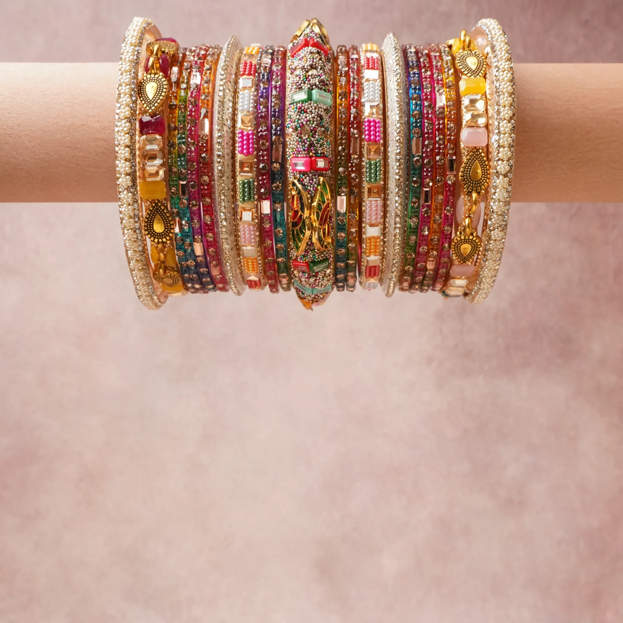 A grounding Multi colour forms the heart of the set, while touches of Ivory, Pale Pink, Fuchsia, Sapphire Blue, Teal, Emerald Green, Ruby Red add charm.

A thoughtful composition of Gold-toned Metal, Glass, Enamel, Faux Pearls, Rhinestones, Lacquer, designed to feel complete without being heavy.
Each element layers seamlessly, creating a look that is refined, wearable and quietly striking.